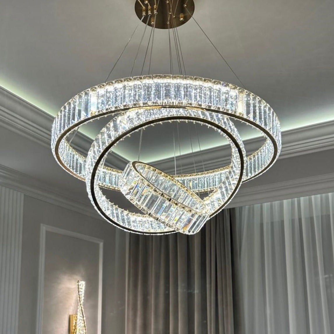 VORELLI® Oia modern triple ring chandelier suspended in refined interior creating dynamic focal lighting