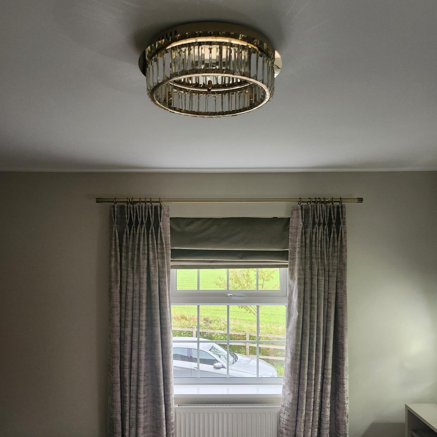 Close up of crystal bars arranged around perimeter of VORELLI® Oia circular ceiling light