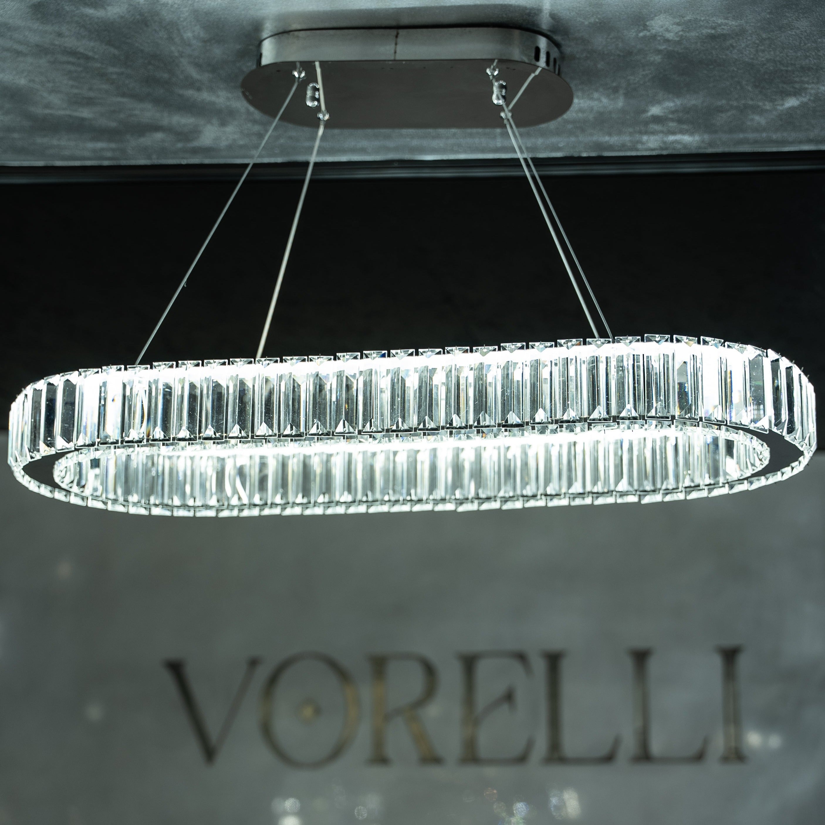 VORELLI® Oia rectangular crystal chandelier enhancing modern living space with structured perimeter crystal bars