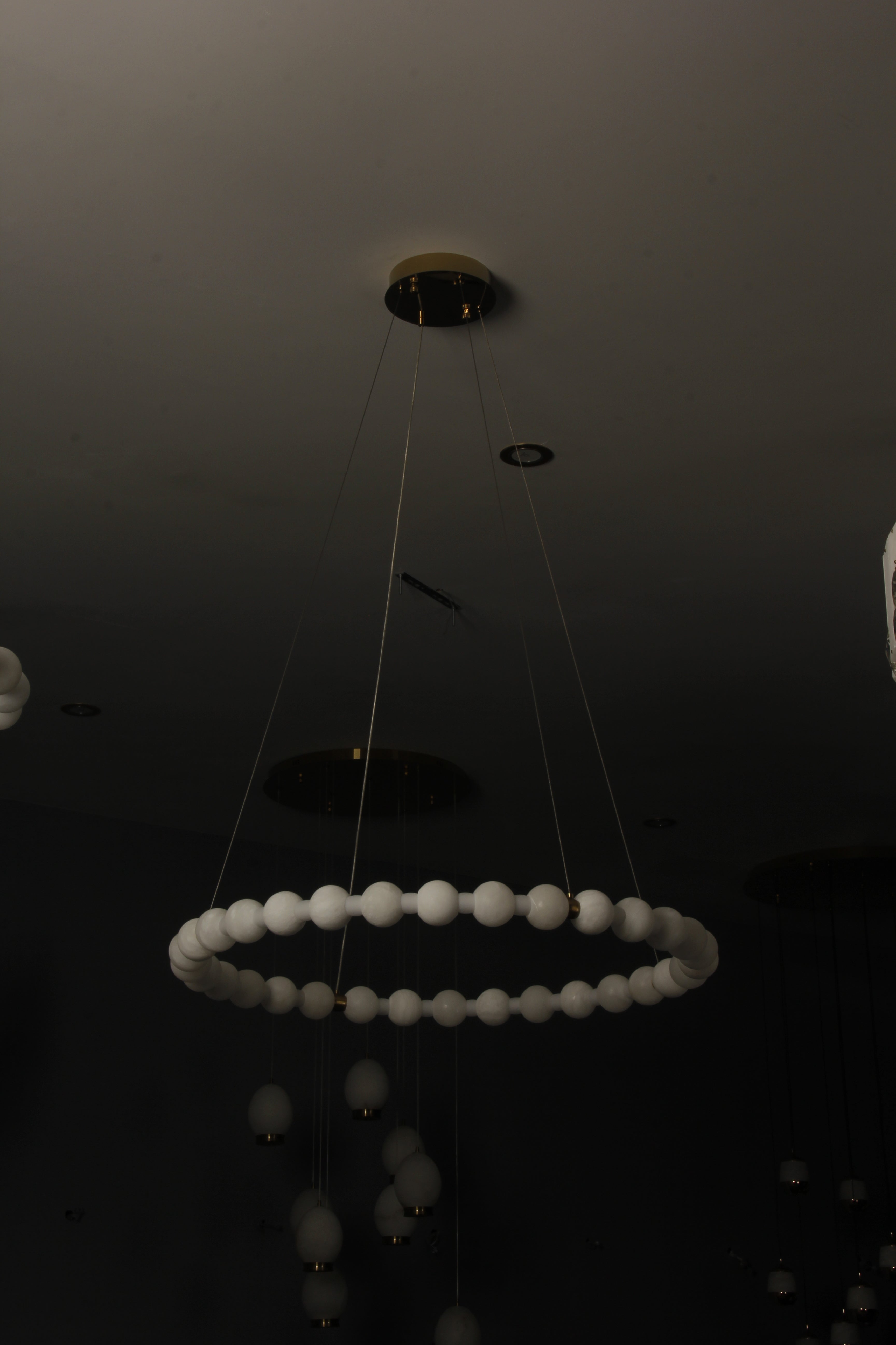 VORELLI® Orbella modern marble ring chandelier installed in upscale interior creating balanced circular lighting effect