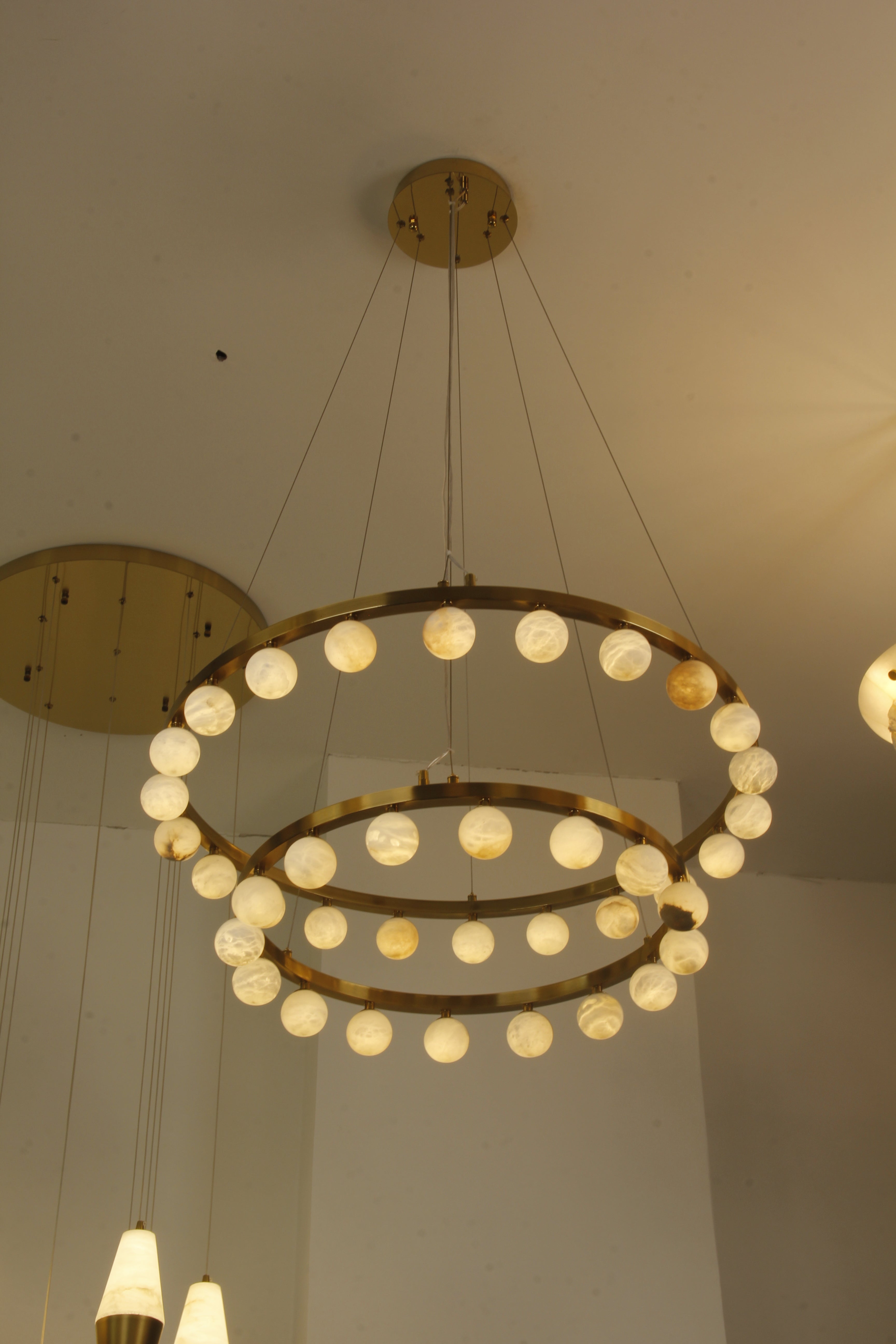 VORELLI® Orbit luxury marble double ring chandelier enhancing refined living space with glowing marble spheres