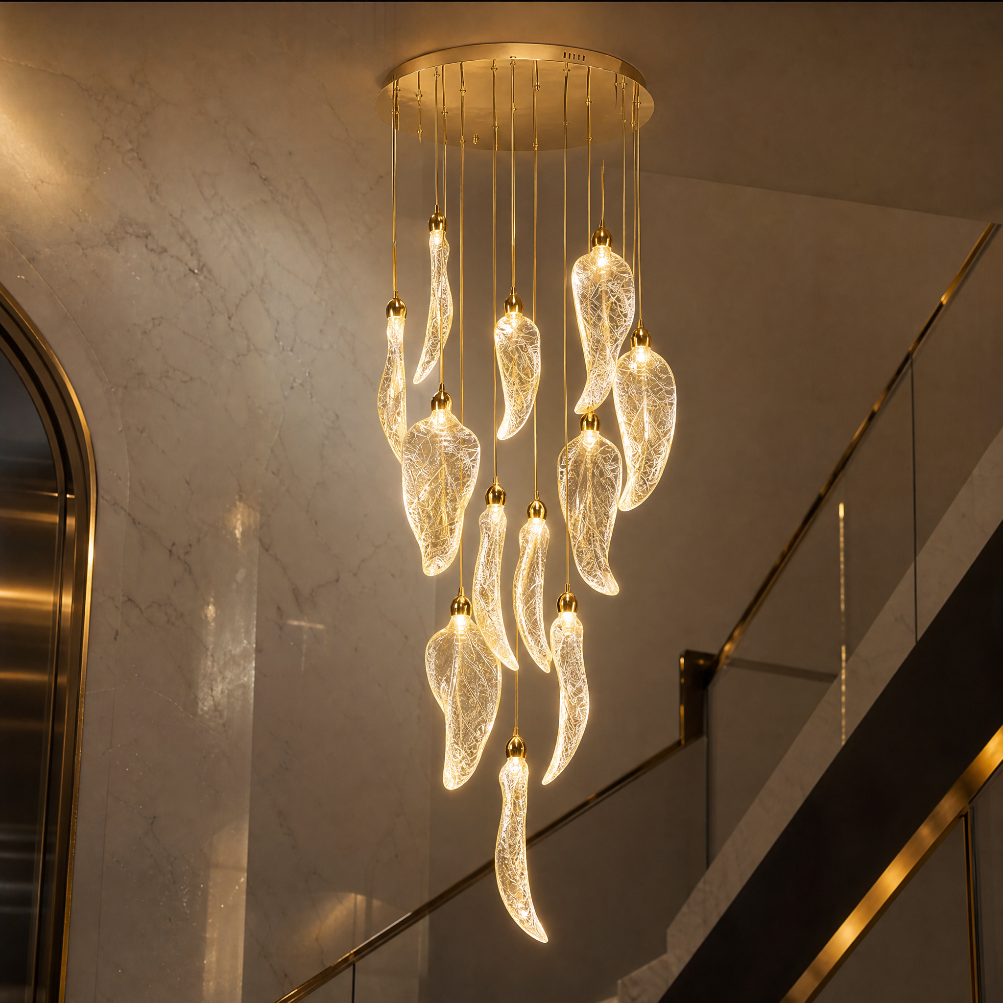 Macro close-up shot of the intricately detailed leaf pendants from the Vorelli Ottobre chandelier, highlighting premium craftsmanship.
