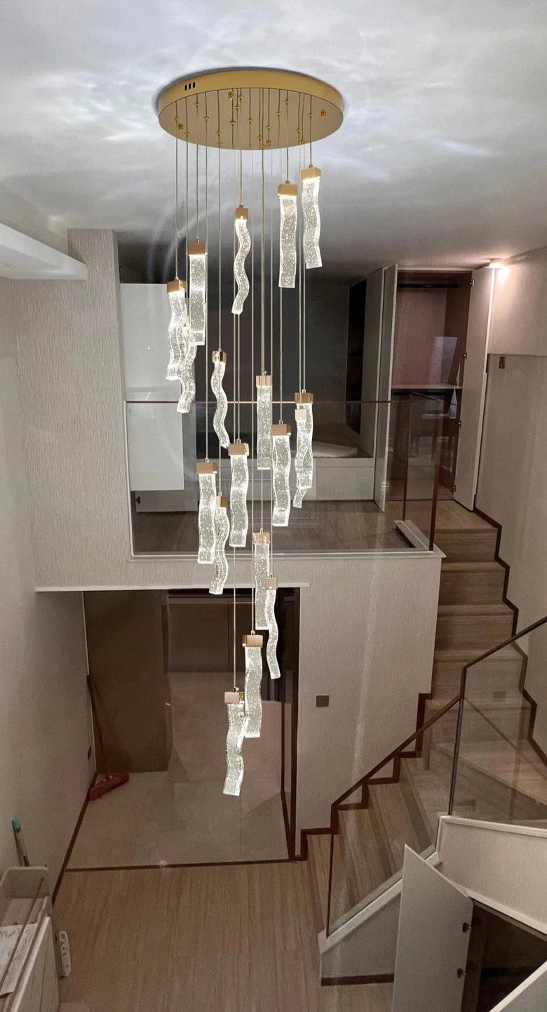 Designer staircase chandelier from VORELLI® Palazzo collection enhancing luxury residential architecture with sculptural crystal light