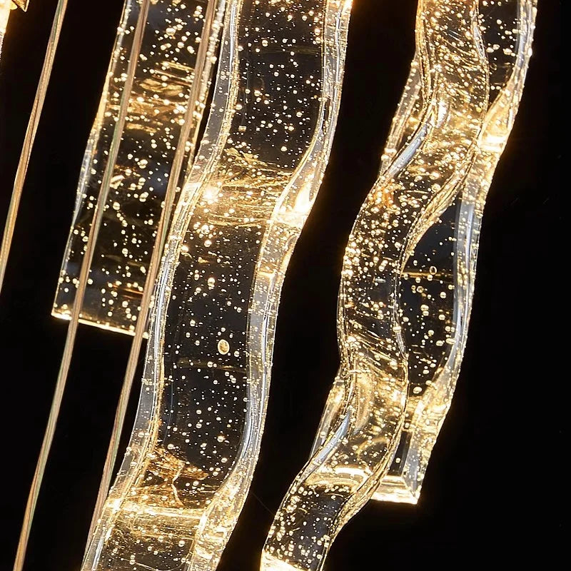 Long cascading Palazzo pendant chandelier by VORELLI® creating statement lighting for staircases and double-height contemporary interiors