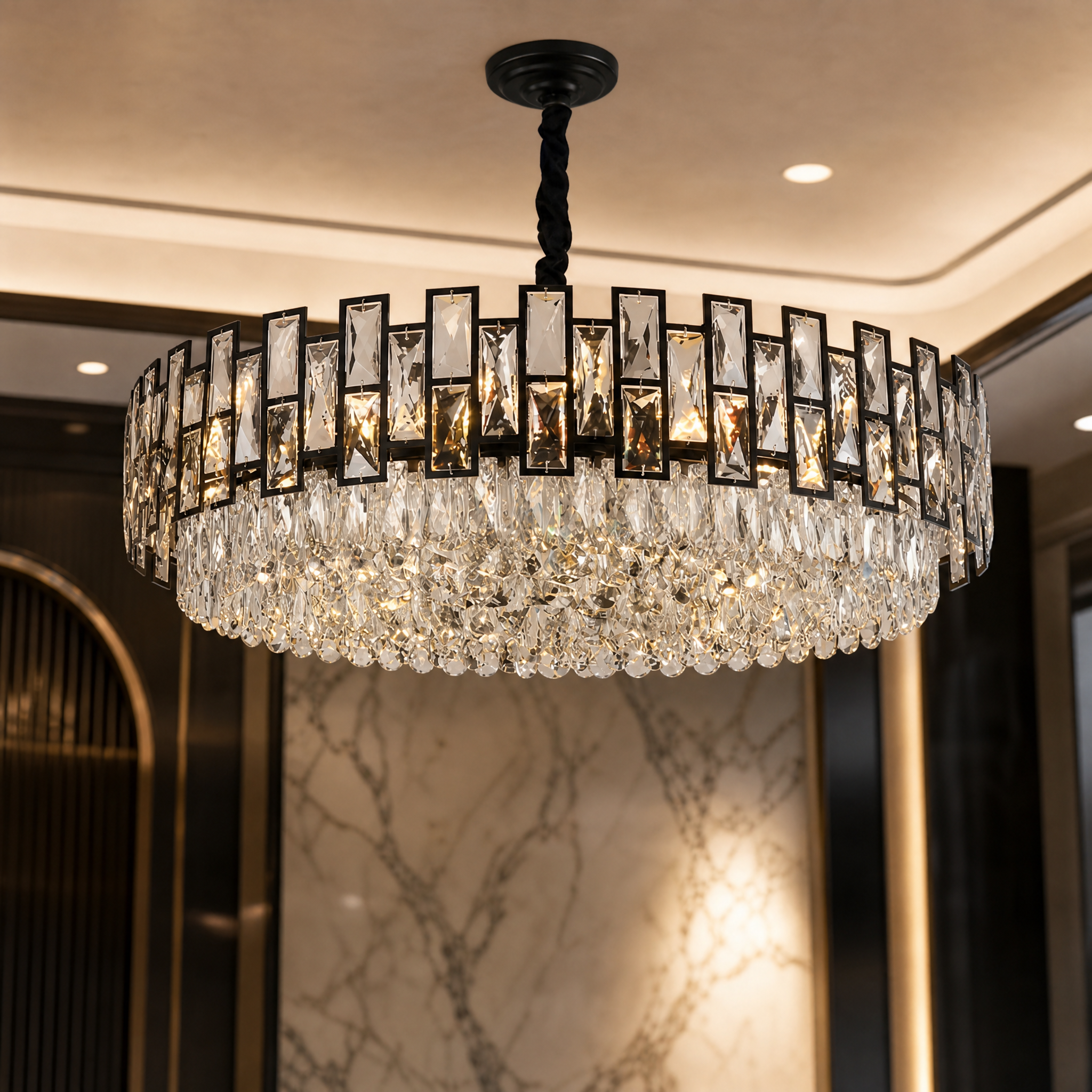 A close-up shot of the VORELLI Presidio chandelier highlighting the combination of sleek rectangle and faceted cut arch crystals.
