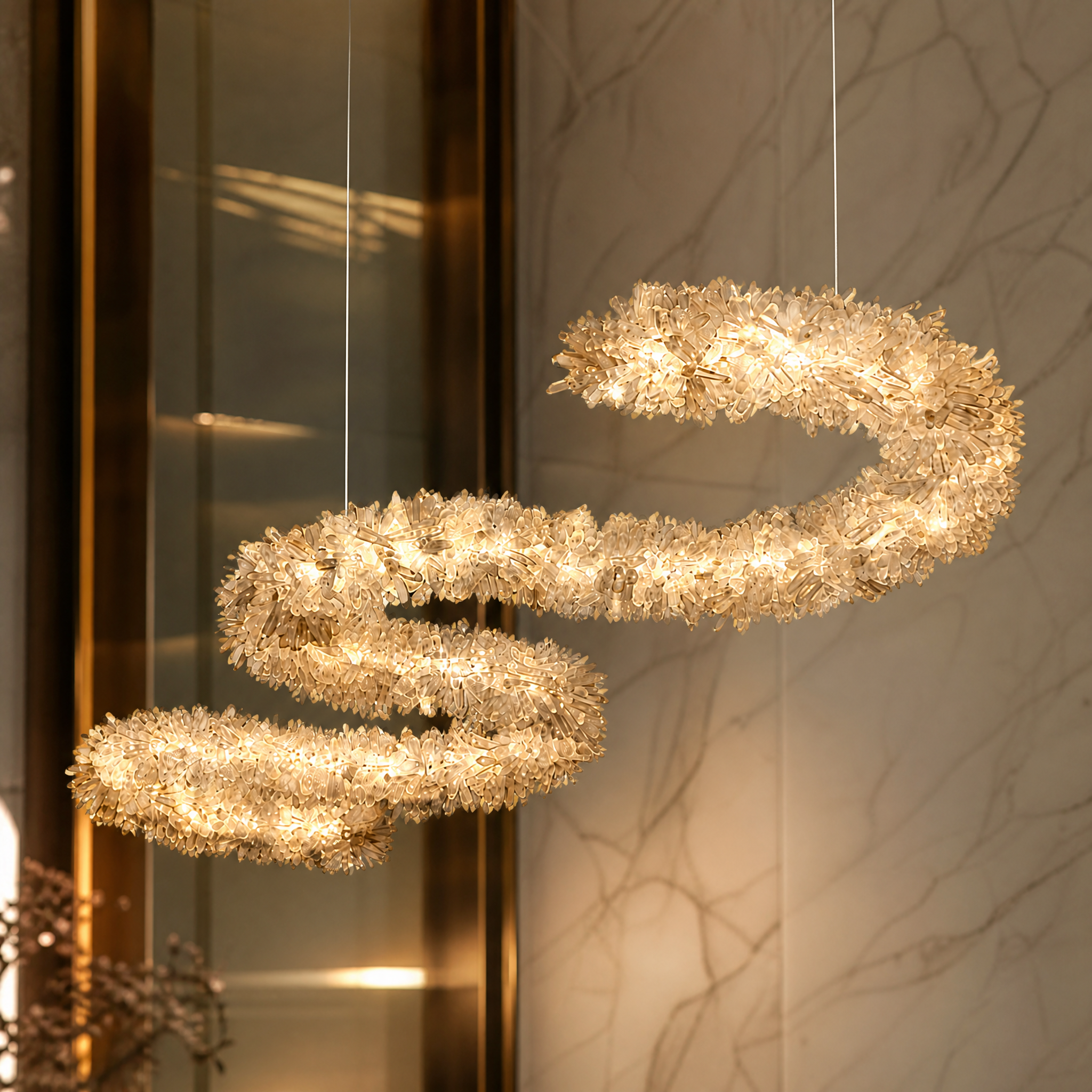 Macro close-up view of the naturally formed quartz crystal shards on the VORELLI Arc Rectangular Chandelier, showing organic texture.