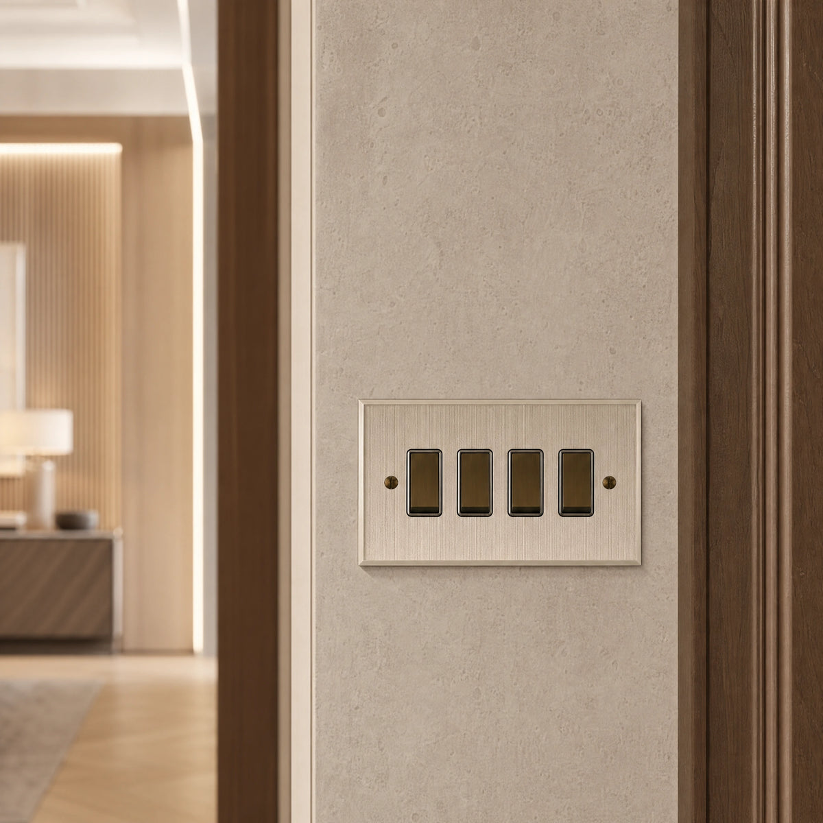 Close-up of a luxury bronze antique rocker switch installed within feature wall beside an elegant doorway with refined timber panelling by VORELLI®.