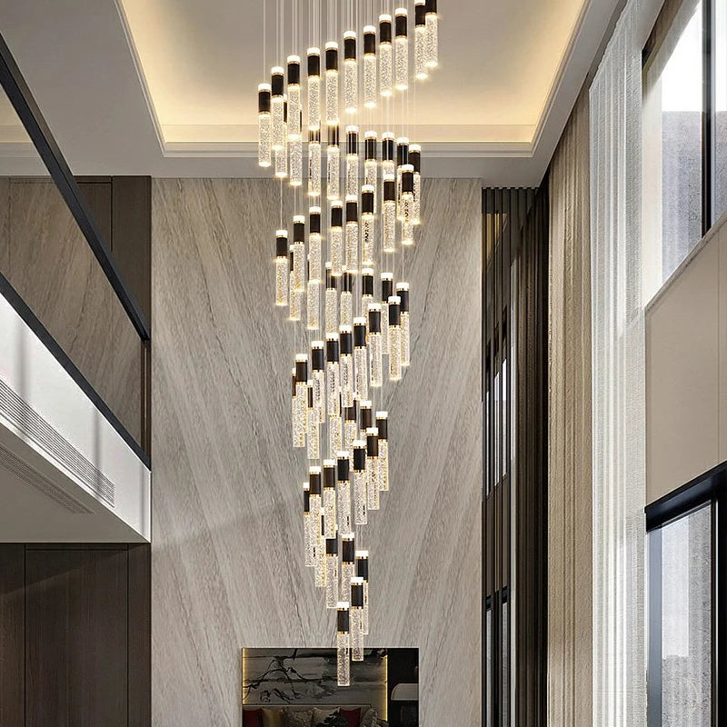 Luxury long stairwell chandelier by VORELLI® featuring suspended crystal tube pendants designed for grand entrance halls and modern statement spaces