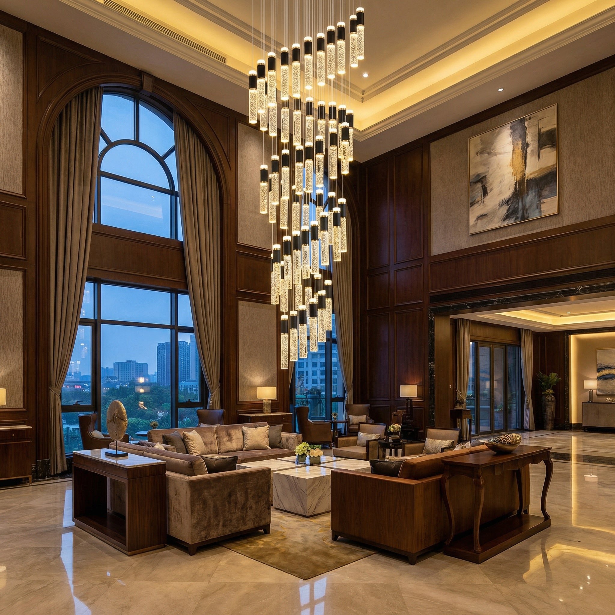 VORELLI® Sagres pendant staircase chandelier with cascading illuminated crystal cylinders creating a striking luxury feature in double-height interiors