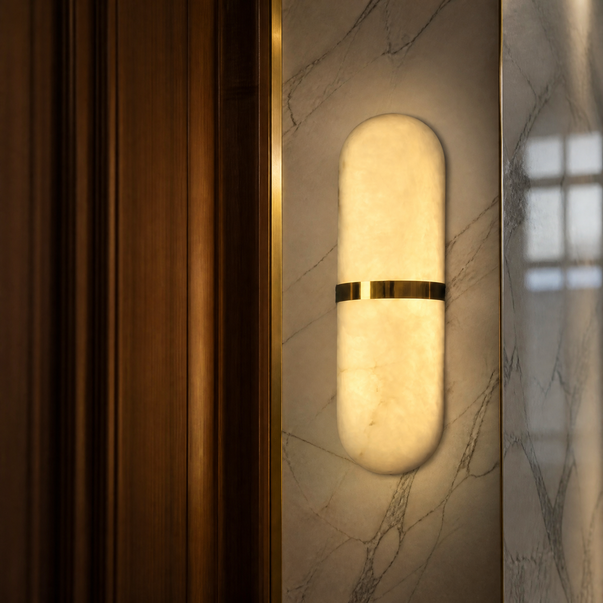 Detailed closeup of the VORELLI Serene Marble Wall Light showcasing its refined, rounded natural marble form and minimalist craftsmanship.