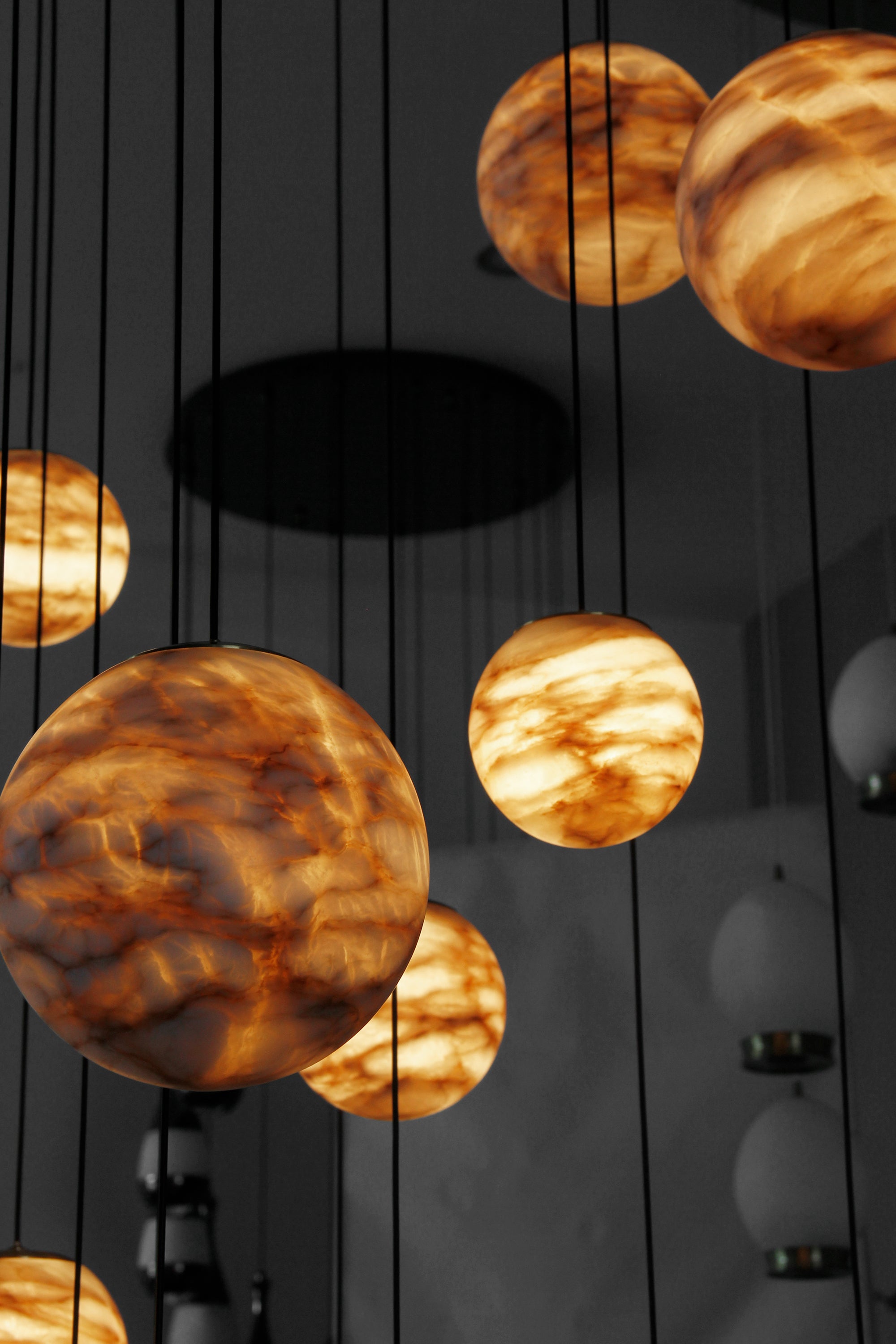 Modern marble staircase chandelier by VORELLI® delivering soft ambient illumination for premium homes, villas, and hospitality interiors