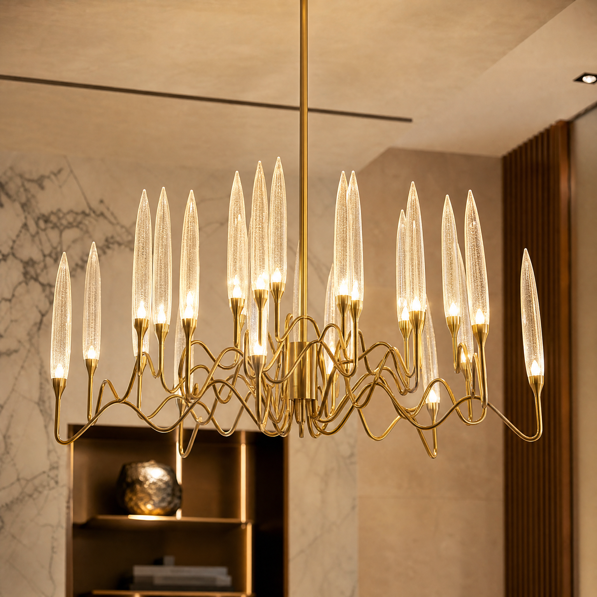 Detailed close-up shot of the VORELLI Tiddington pendant, showcasing the intricate sinuous frame and large bubble-effect crystal cone.