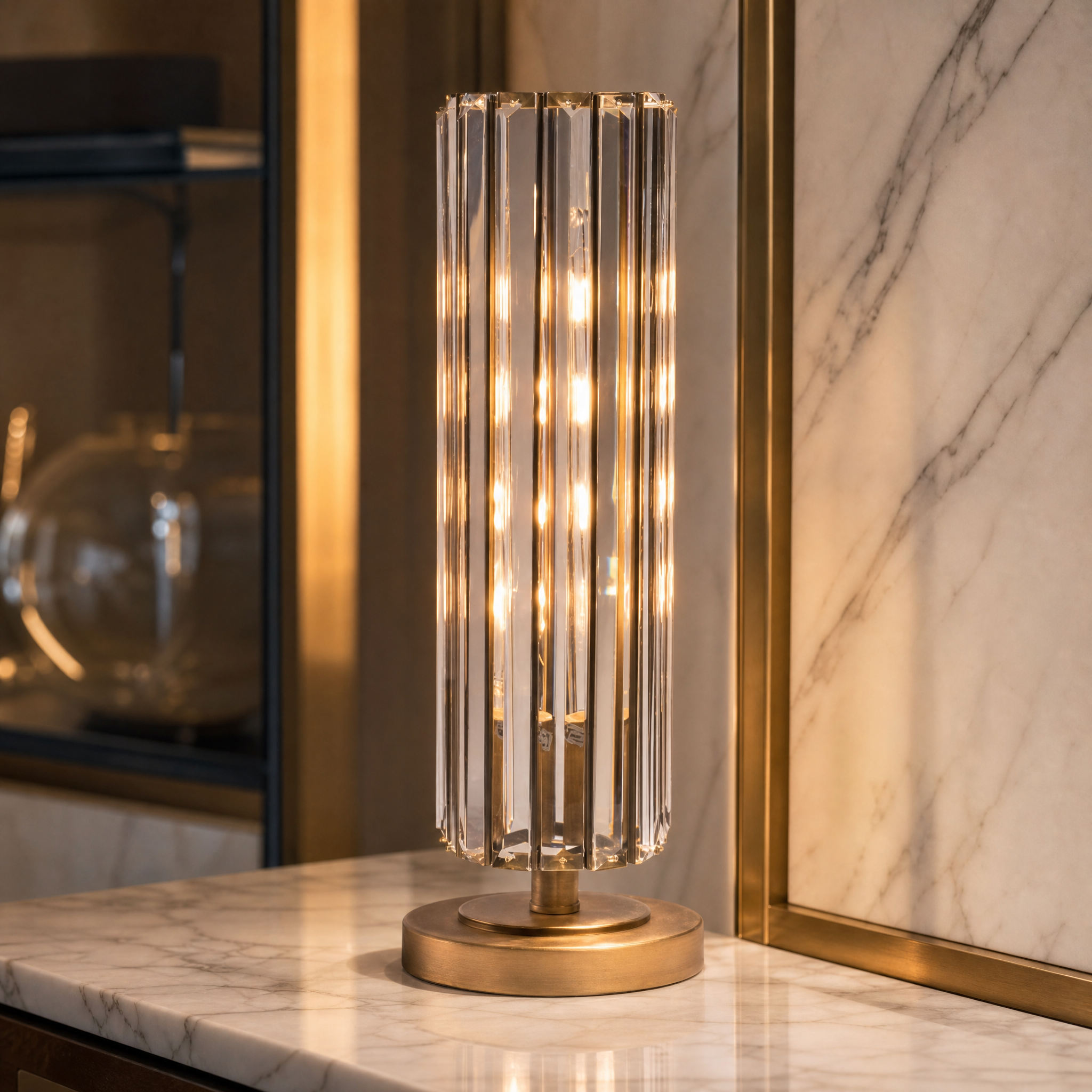 A detailed closeup shot of the VORELLI Torvane table lamp showing the architectural alignment of the crystal rods framed in antique brass.