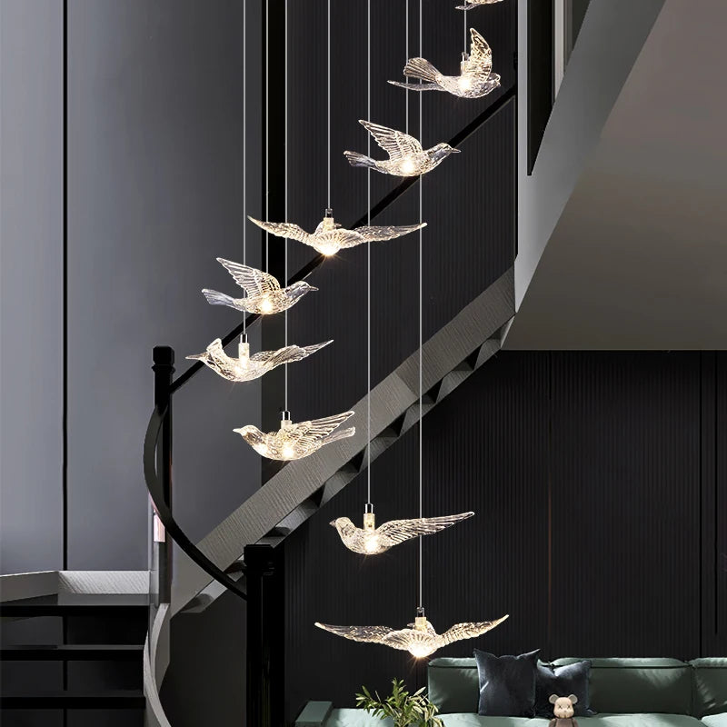 Tall cascading pendant chandelier designed for stairwells, atriums, and double-height luxury interiors