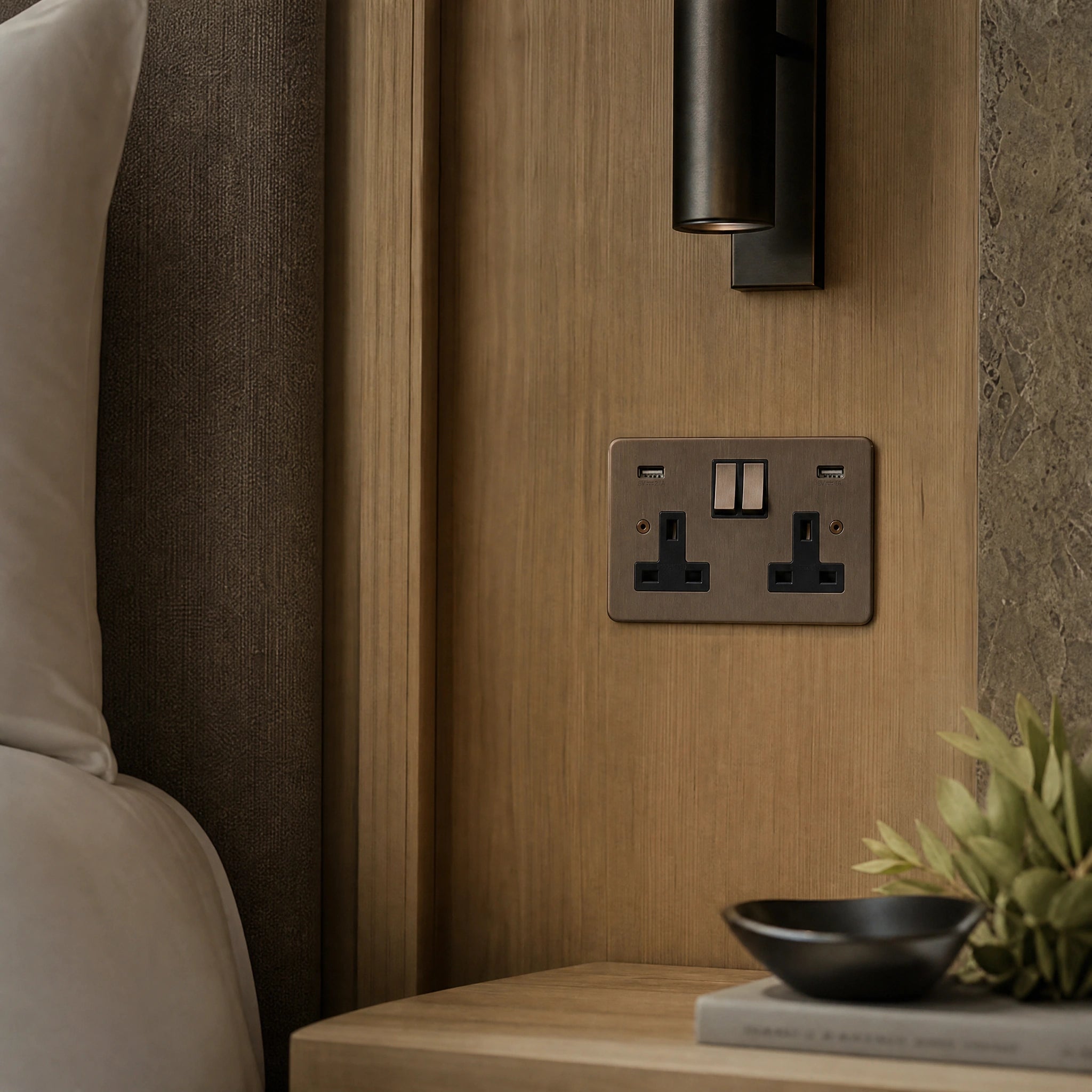 Luxury antique brass usb socket installed within bespoke bedside joinery in a luxury bedroom suite by VORELLI®.