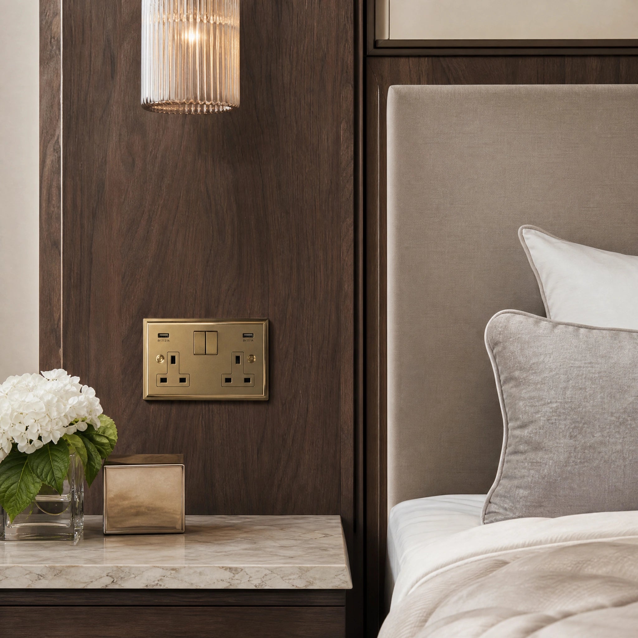 Luxury antique brass usb socket installed within bespoke bedside joinery in a luxury bedroom suite in a UHNW interior by VORELLI®.