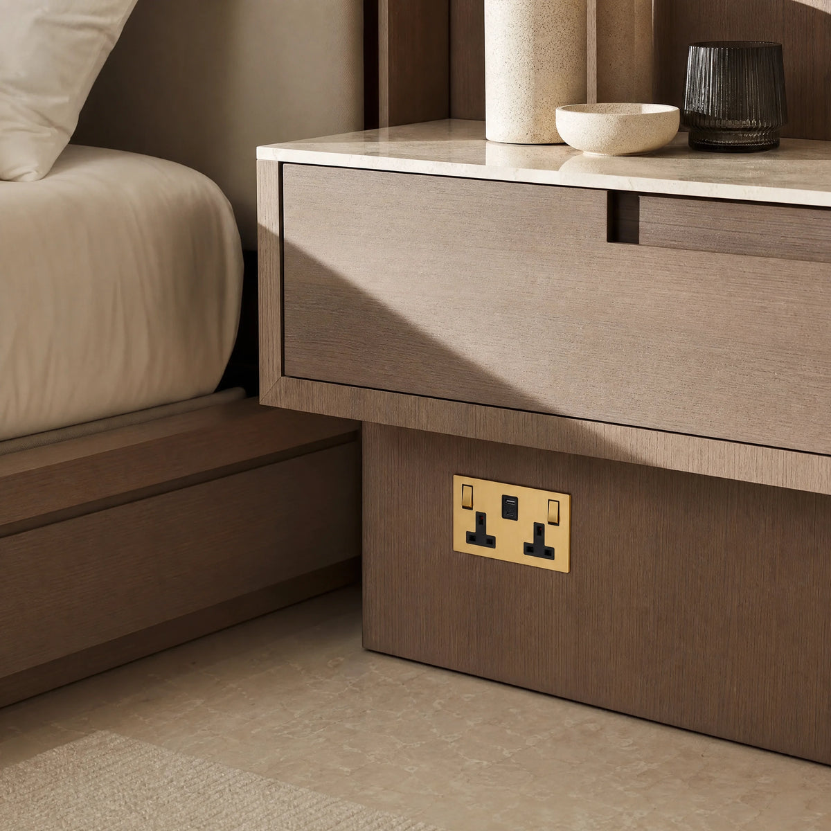 Luxury ochre usb socket installed within bespoke bedside joinery in a luxury bedroom suite in a UHNW interior by VORELLI®.