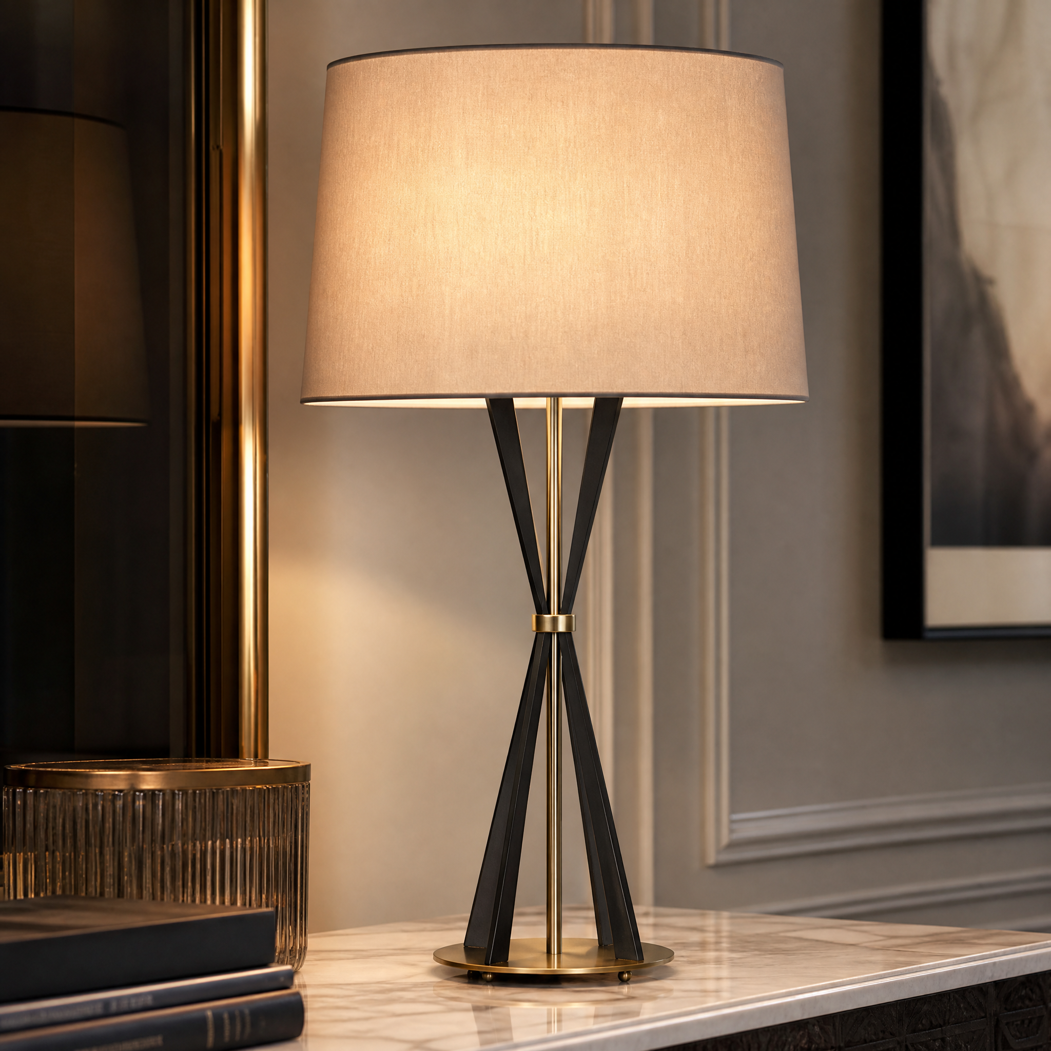 A detailed closeup of the VORELLI Valtero table lamp, showcasing the rich texture blend of dark and light antique brass finishes on its tapered base.