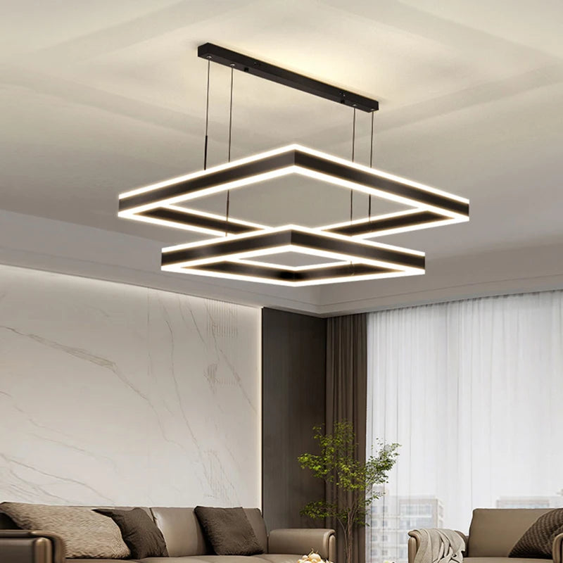 Square LED chandelier with double frame design over dining area in modern interior space