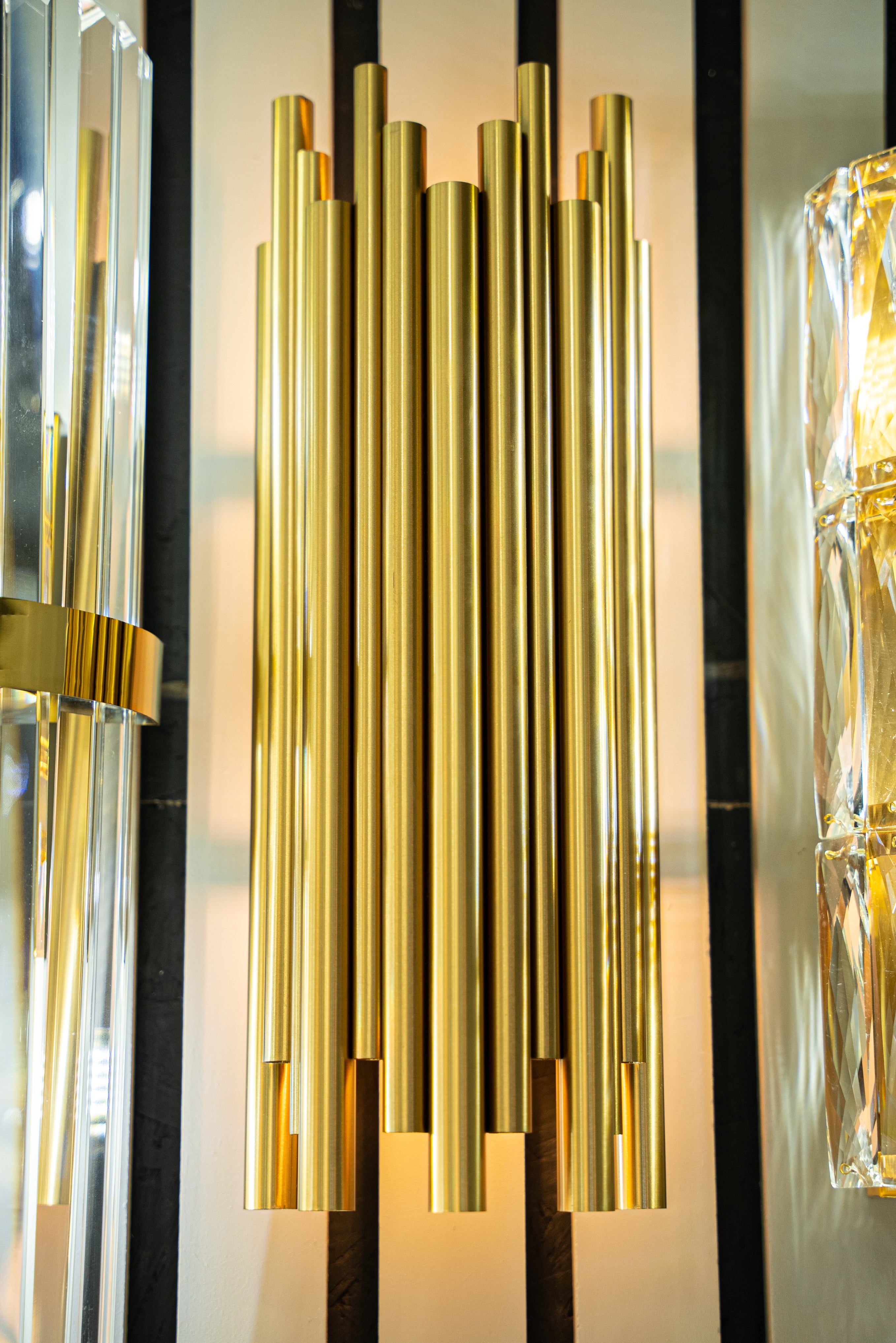 Close-up of cylindrical tube elements on wall light showing refined modern design