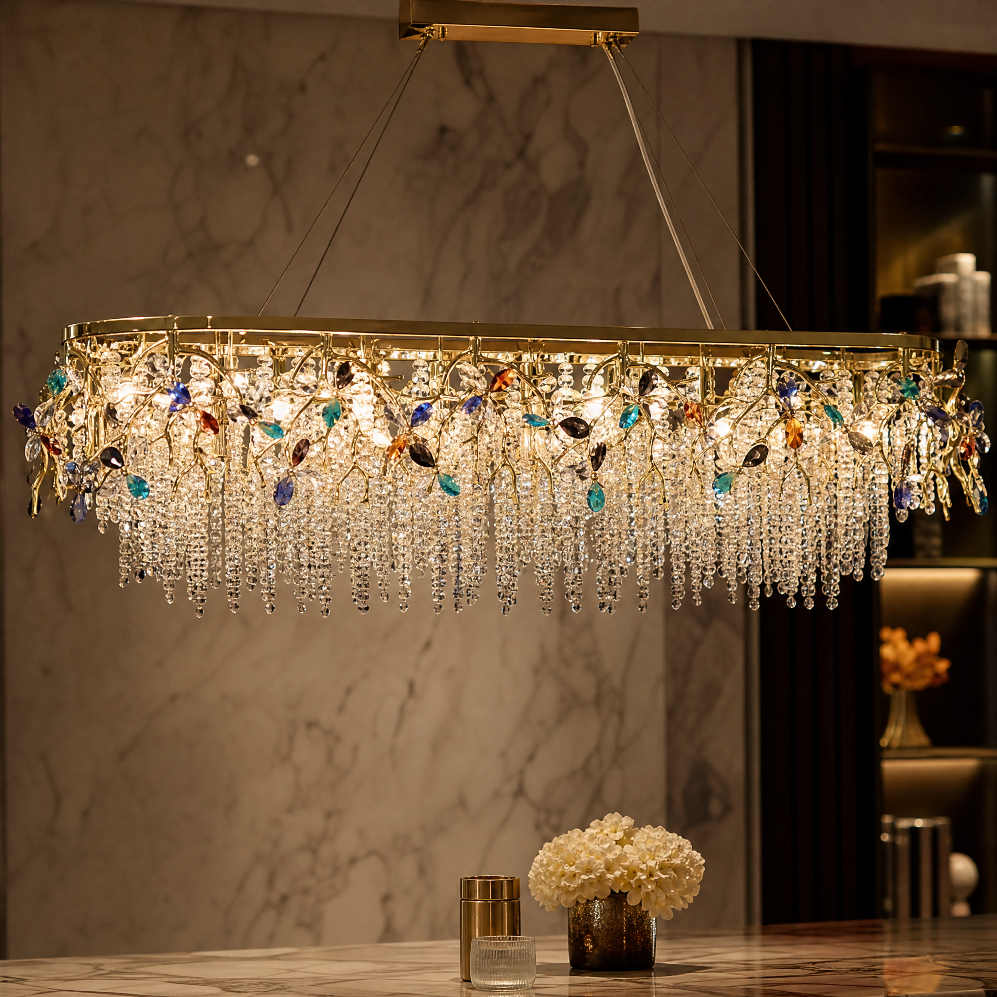 A detailed closeup of the VORELLI Wisteria Rectangular Chandelier III, highlighting the gracefully layered crystal strands and sculptural branch detailing.