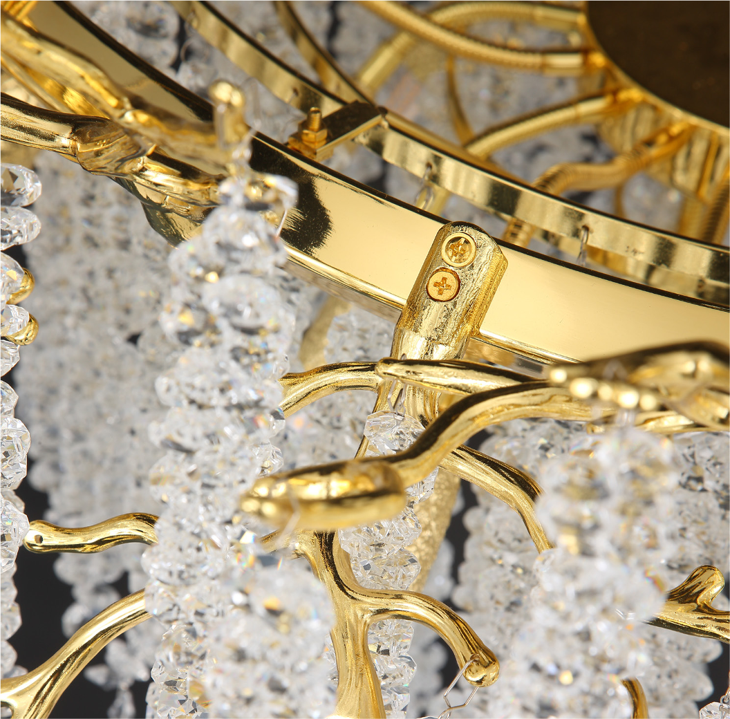 Close-up of Wisteria chandelier showing crystal droplets and gold branch detailing