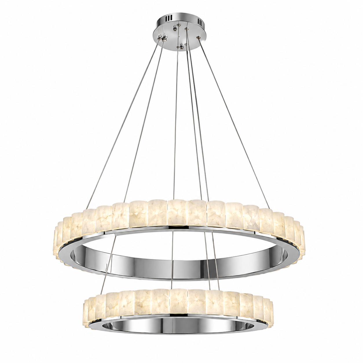 Warm, ambient mood lighting glowing through the hand-carved marble tiers of the Elysia fixture.