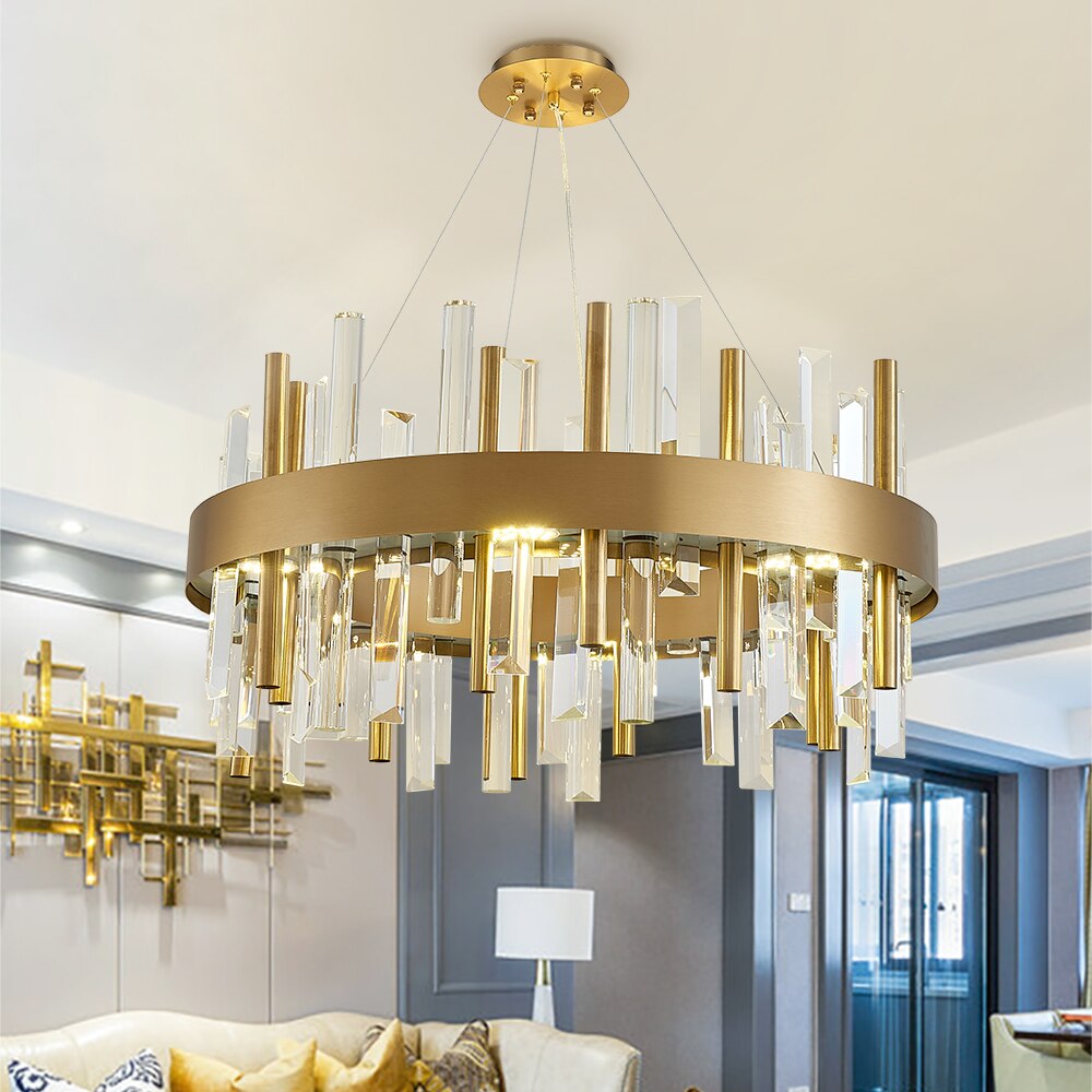 Luxurious gold ring chandelier with crystal bars in a modern interior setting.
