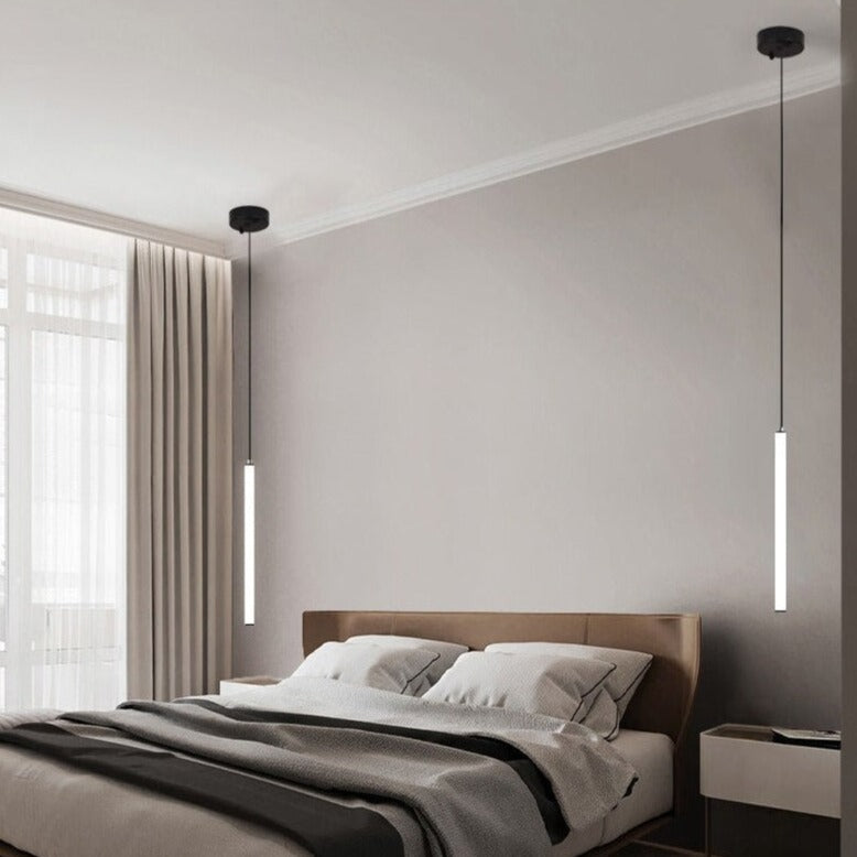 side view of cowley pendant showing slim cylindrical form in contemporary bedroom