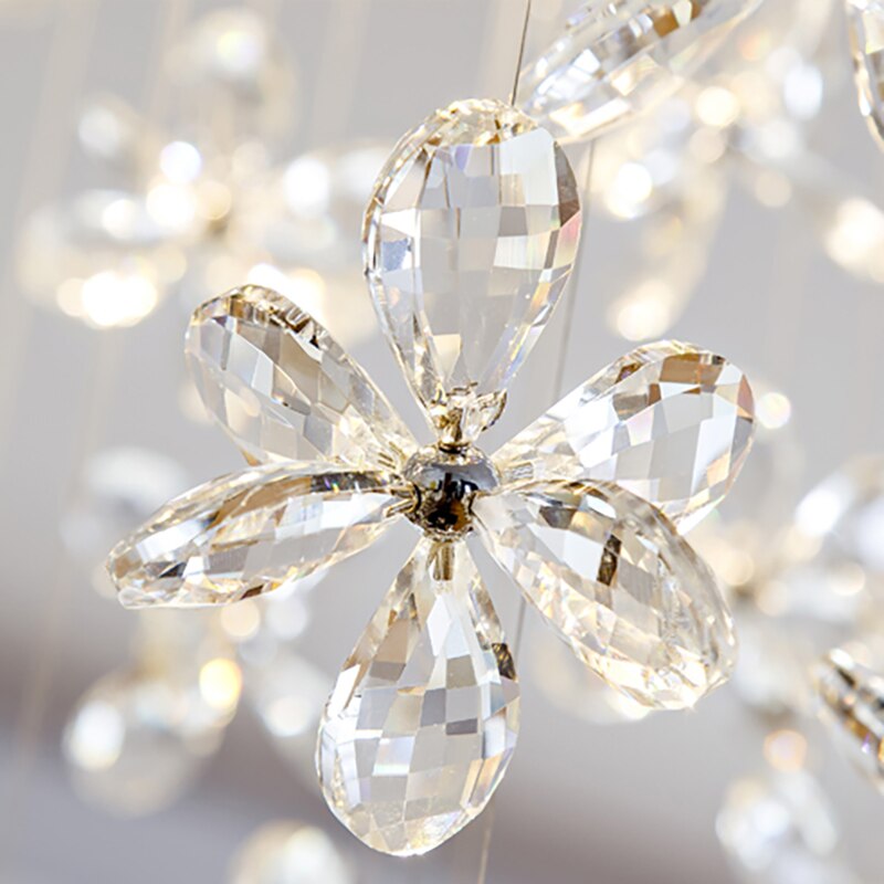 Macro detail of diamond cut flower crystal pendant on a luxury staircase chandelier