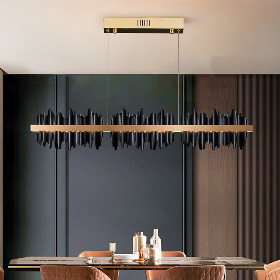 Douala Rectangular Chandelier illuminating a contemporary dining area with cultural sculptural details