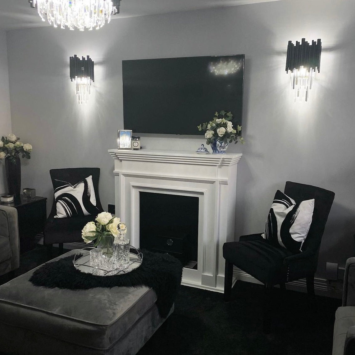 Pair of Gotham wall lights adding refined accent lighting to a modern living room interior