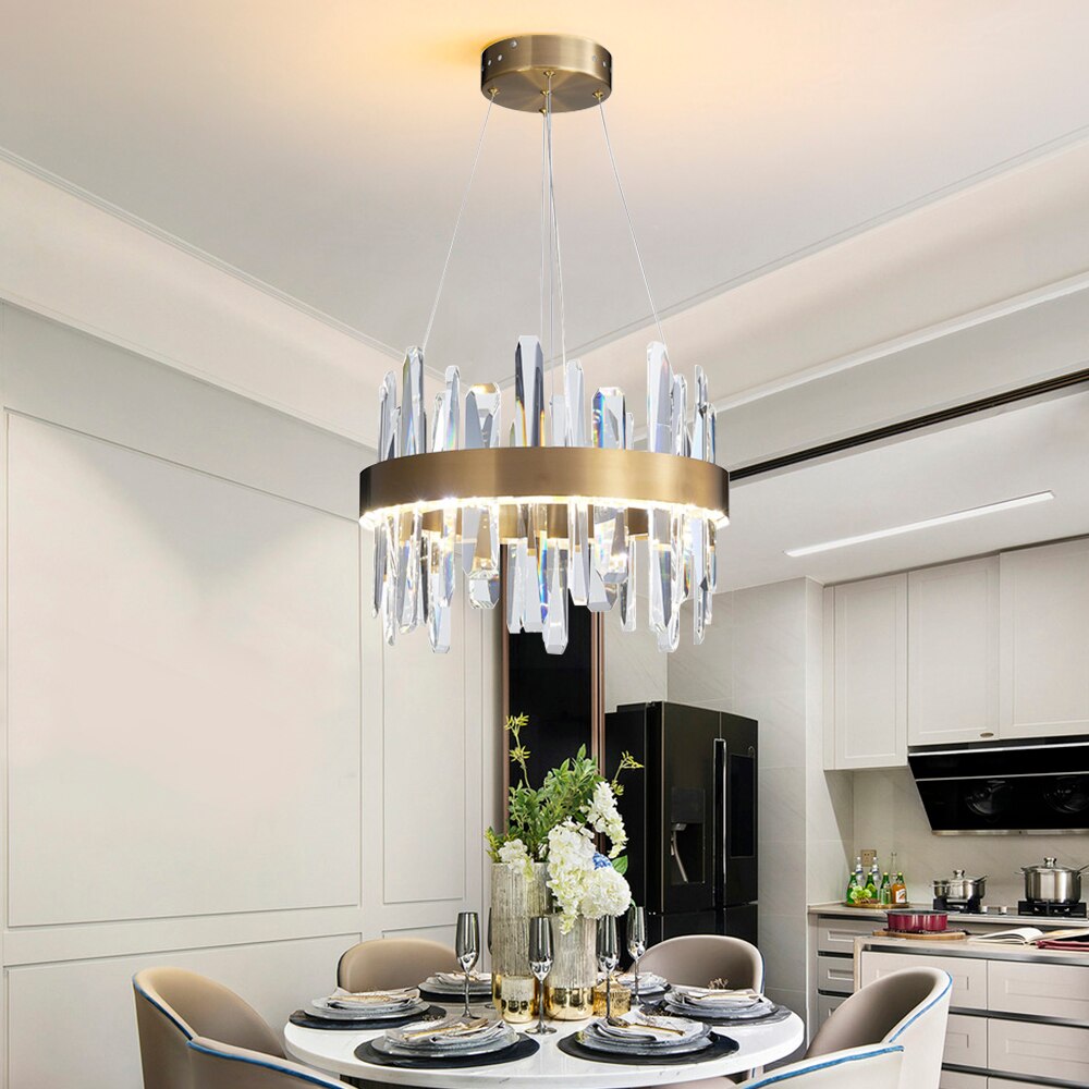 Grantchester Pendant with diamond cut faceted crystals suspended above a luxury dining space