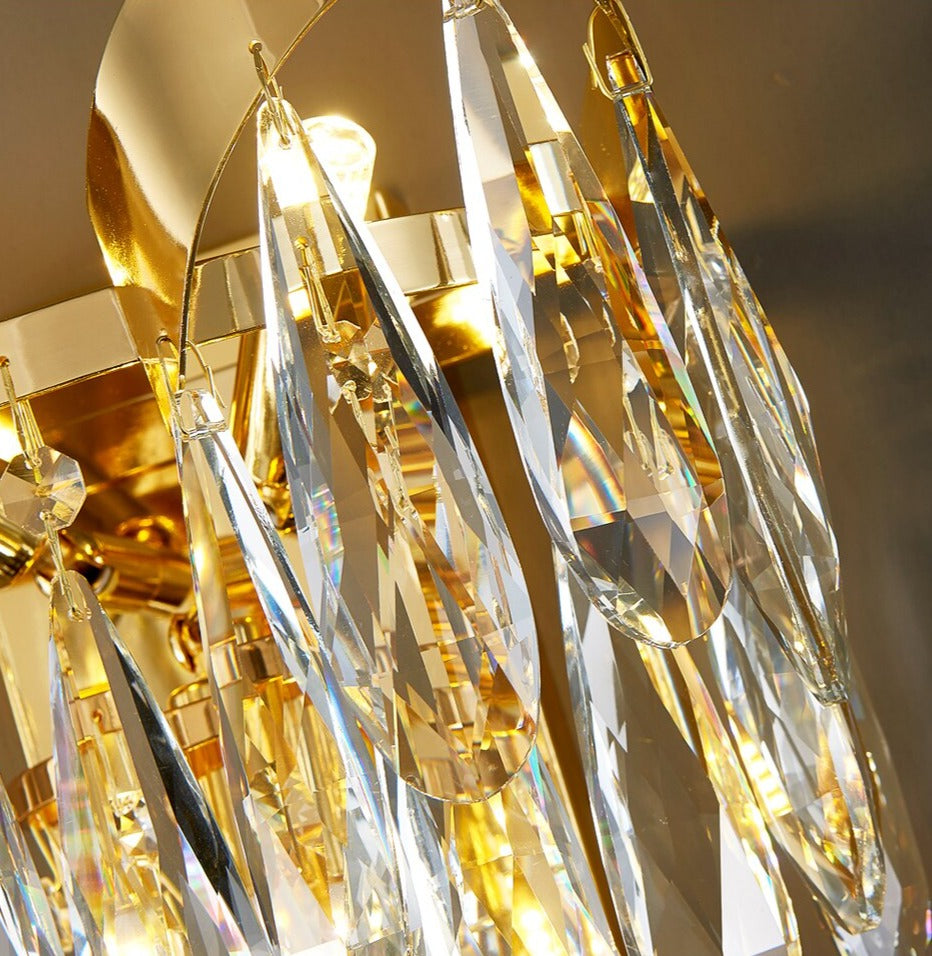 Detailed macro view of diamond cut teardrop crystals on the Isso Wall Light
