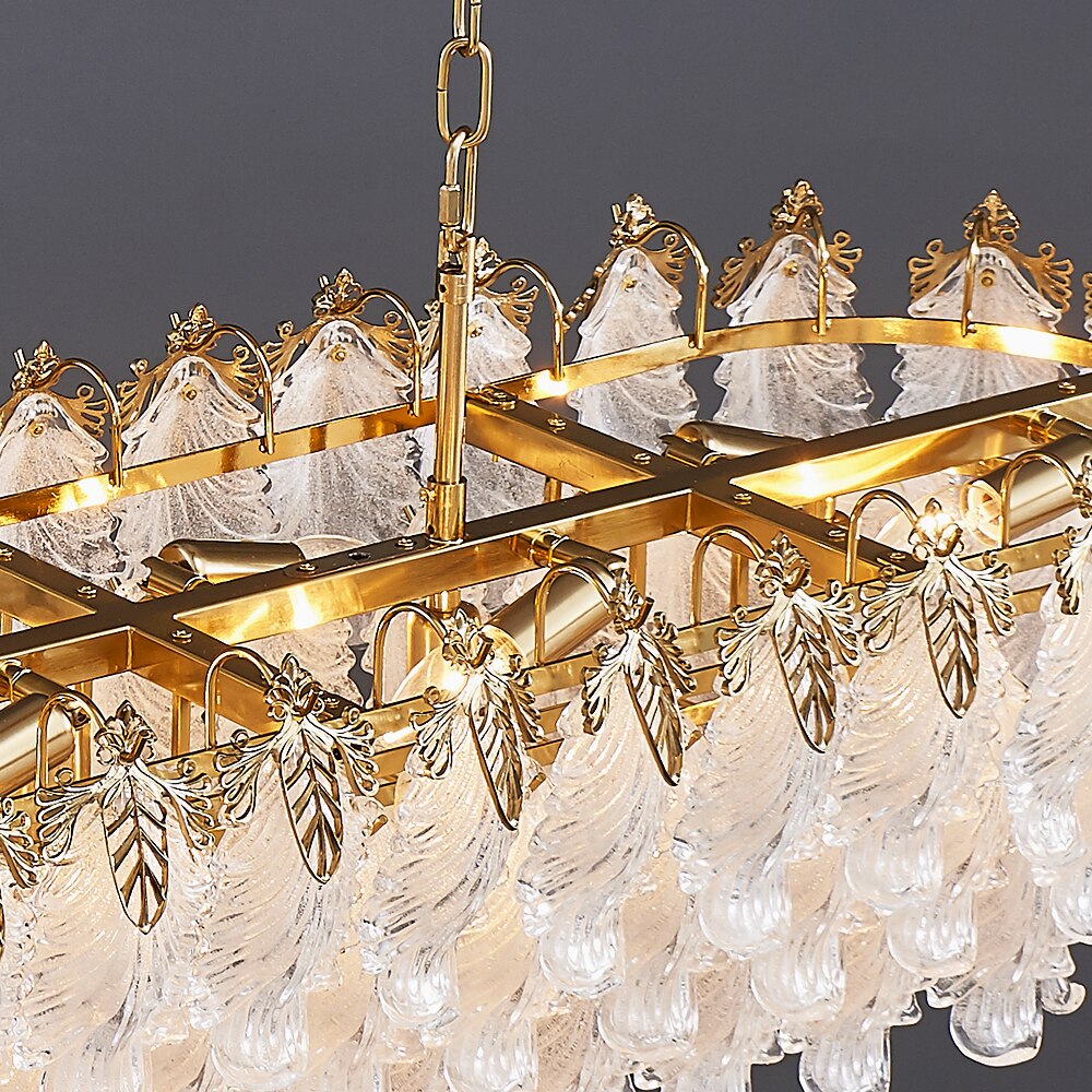 Close up of rectangular chandelier frame with layered feather shaped crystal elements