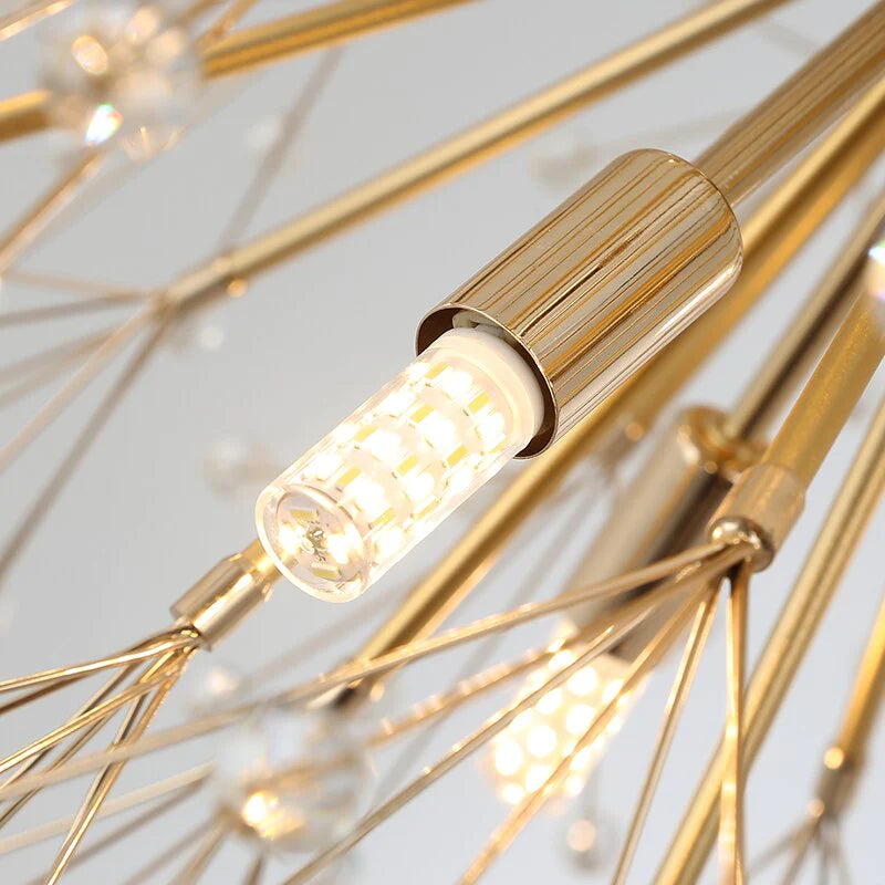 Close-up detail of the Kadupul Pendant showing illuminated crystal arms and refined sculptural design