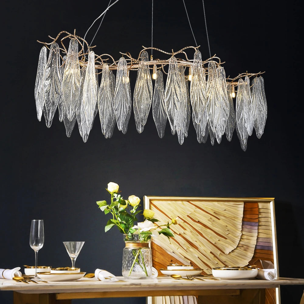 Luxury Larvotto rectangular chandelier above dining table with leaf glass and sculptural branches