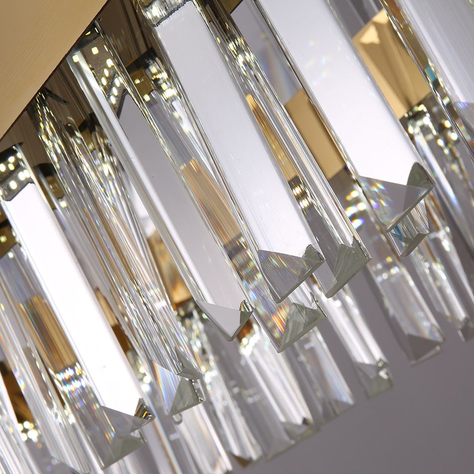 Detailed view of clear faceted crystal bars arranged along a rectangular chandelier structure
