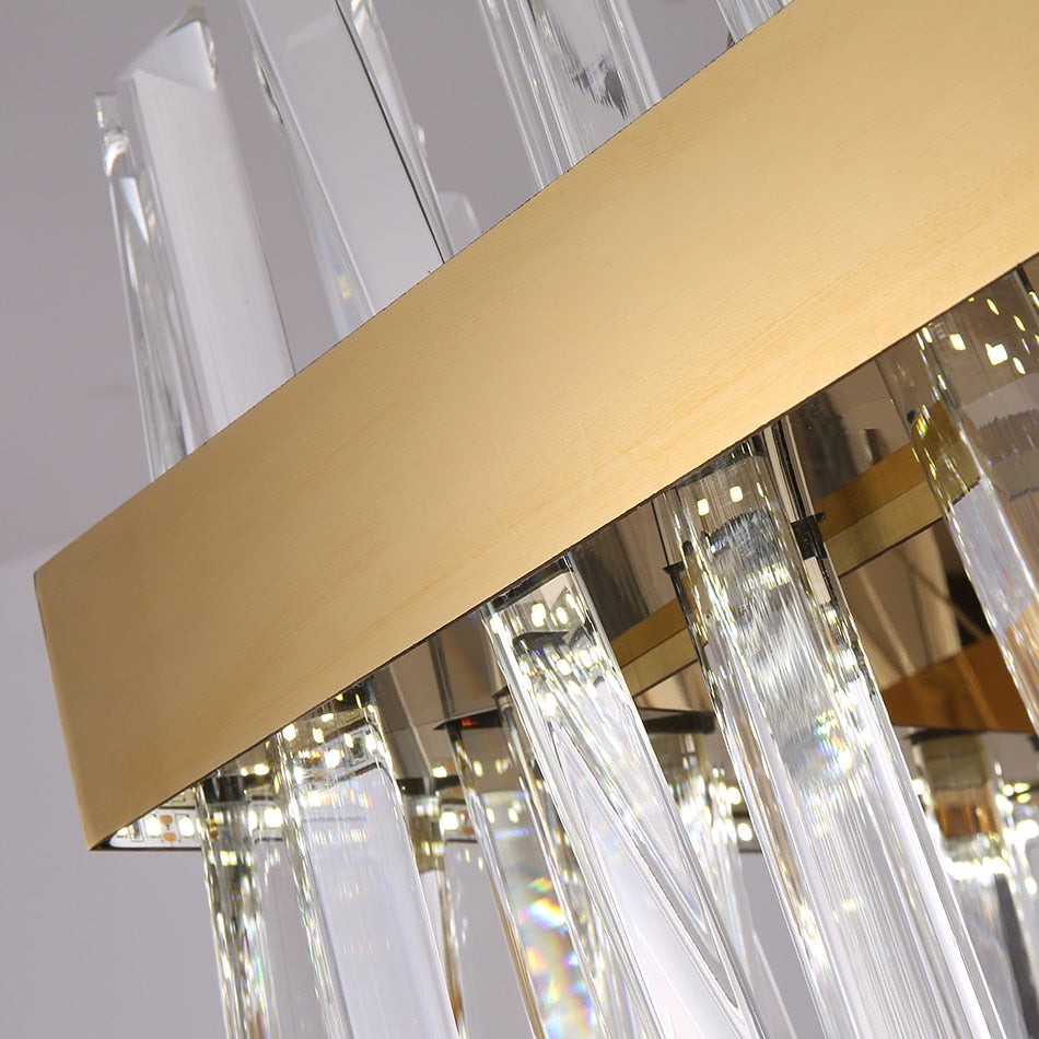 Close-up of the rectangular chandelier frame highlighting brushed metal finish and crystal suspension points