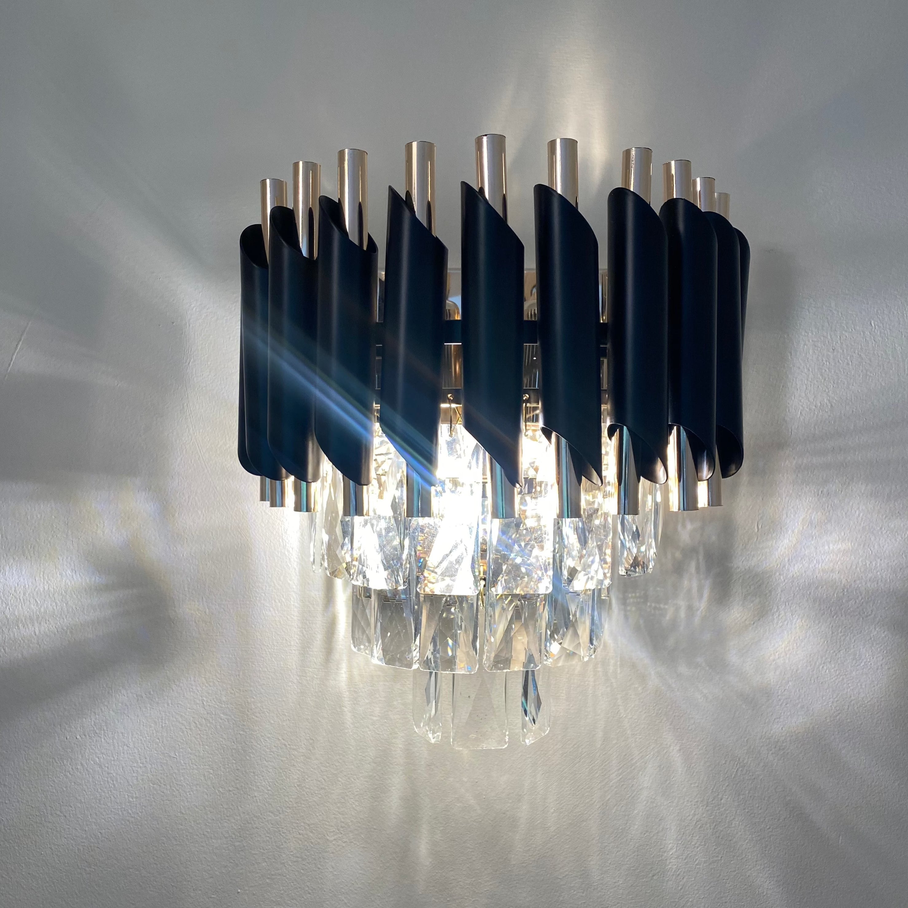 Milltimber wall light featuring bold blue crystal elements and contemporary luxury styling