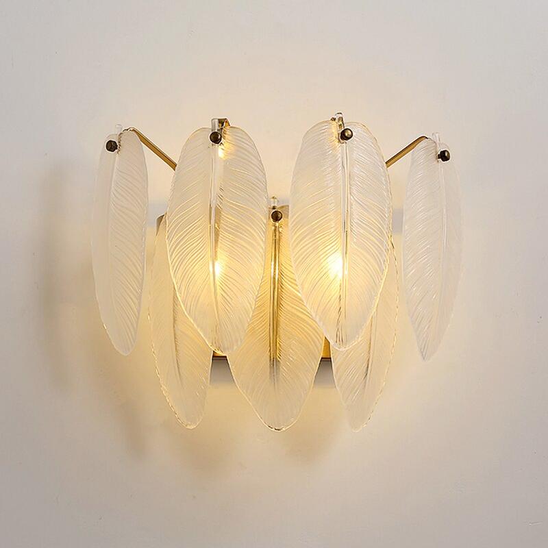 Piuma modern feather crystal wall sconce installed in refined interior creating soft ambient glow