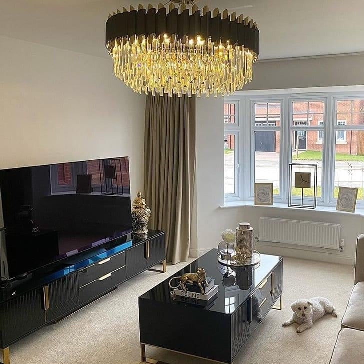 Richmond luxury round crystal chandelier enhancing contemporary lounge with cascading crystal bar detailing