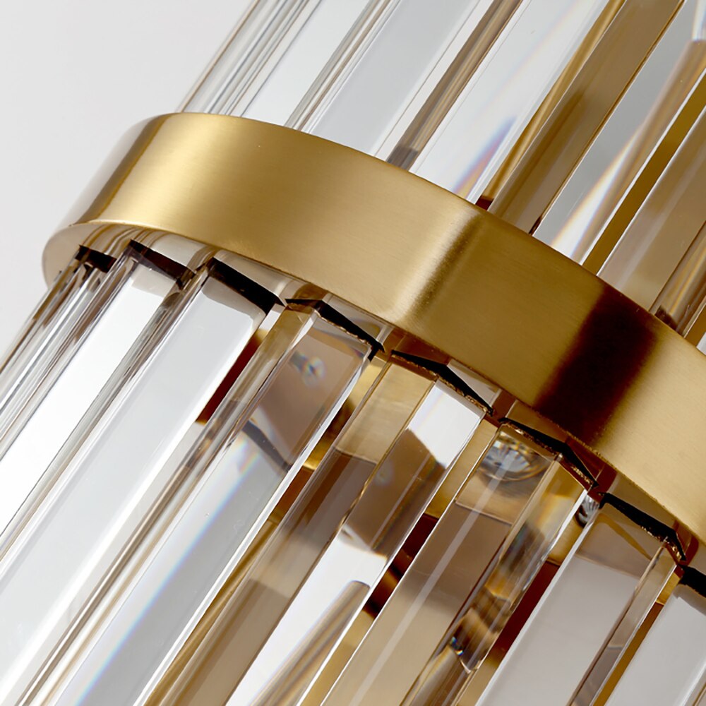 Detailed view of circular wall plate and extended arm supporting crystal drop on Runtz Wall Light II