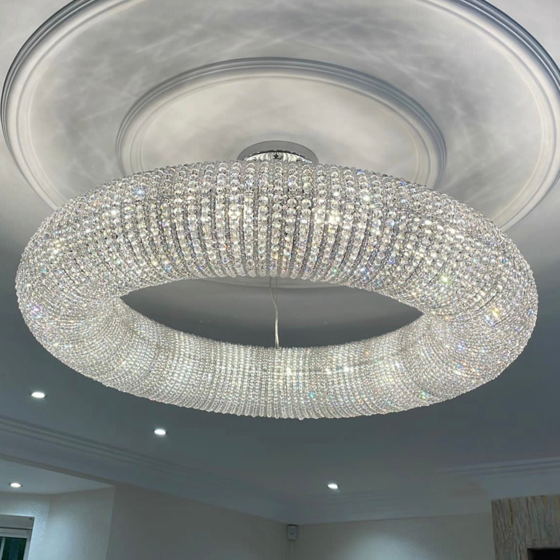 Seminyak modern ring crystal chandelier installed in contemporary interior creating refined ambient glow
