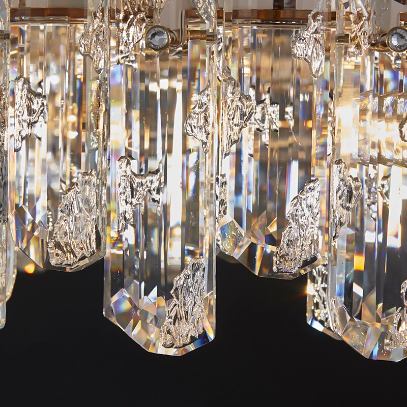 Stellina circular crystal chandelier styled in contemporary dark interior setting