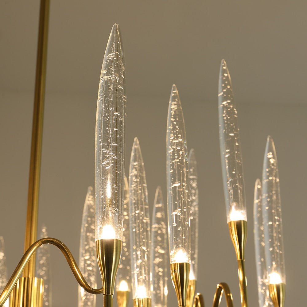 Detailed view of the sinuous brass frame of the Tiddington pendant light