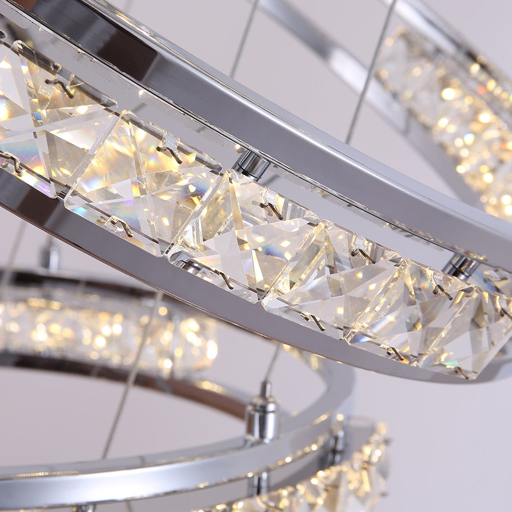 Close-up of illuminated crystal LED ring detail on the VORELLI Vermacelli staircase chandelier