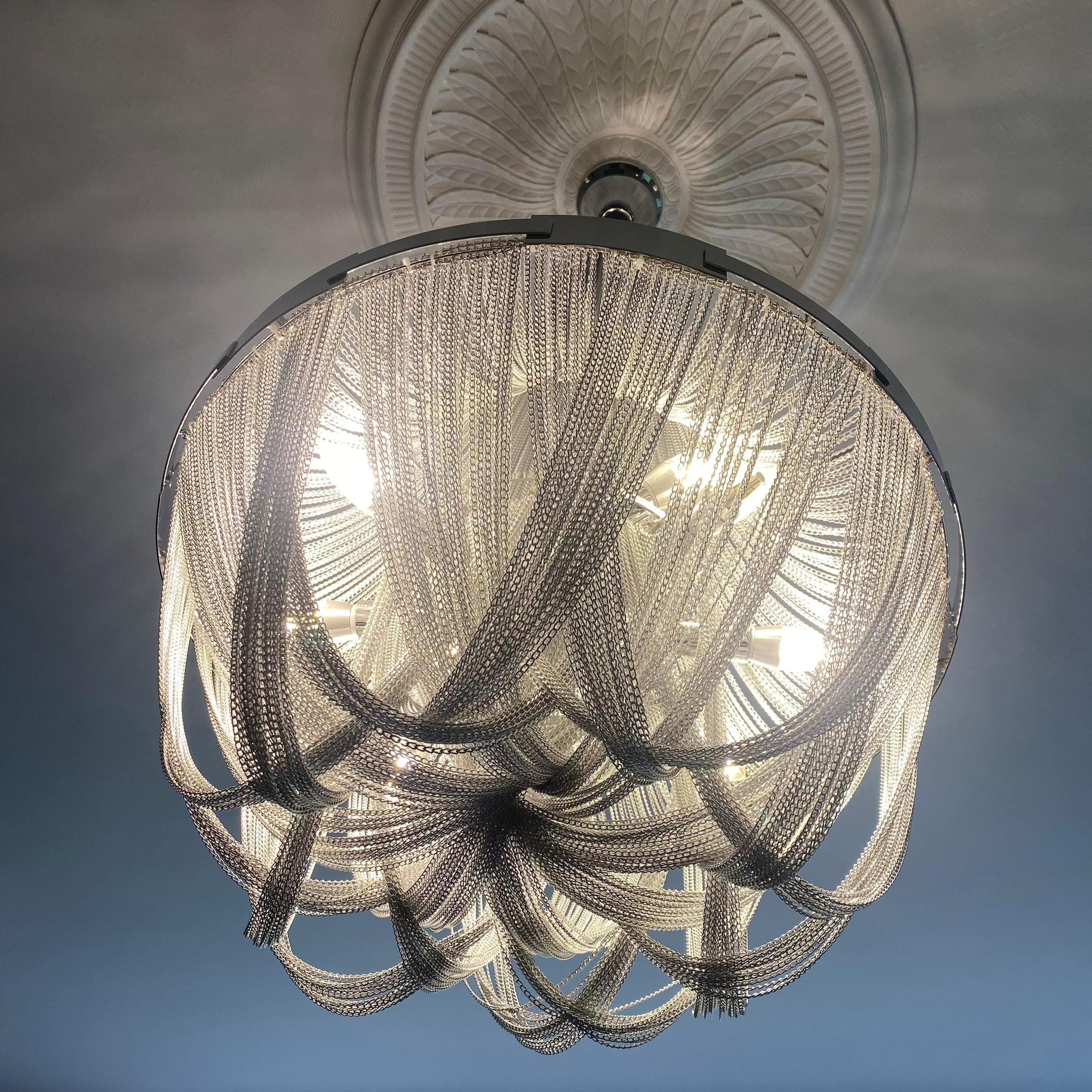Detailed view of the Adlington Grandeur chandelier highlighting its sculptural underside and layered crystal chains
