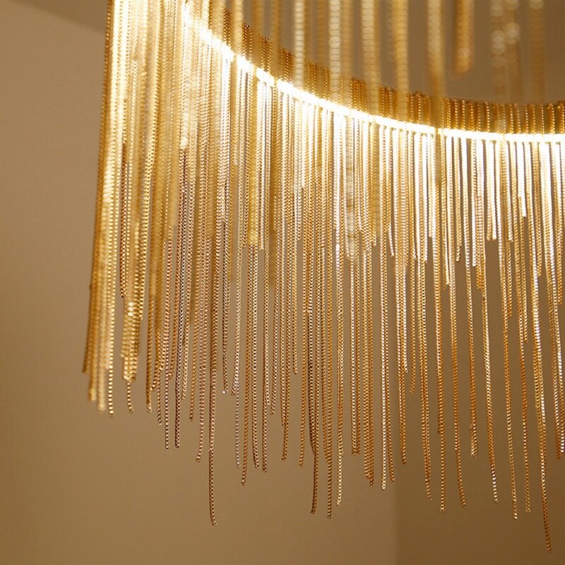 Close-up of VORELLI® Adlington Rectangular Chandelier showing cascading gold chains and edge lighting