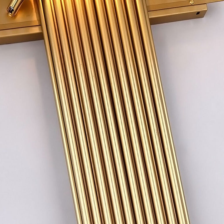 Detailed side view of the Alora wall light showing gold frame and crystal rods with refined clarity.